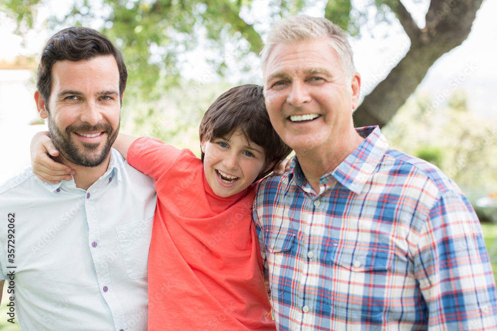 Multi-generation men smiling