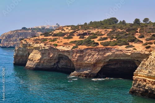 Sandstone Cliffs that Forms Benagil Cave in Algarve Coast, Portugal. Grotto with Atlantic Ocean in front of it in Carvoeiro.