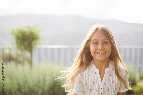 Girl smiling outdoors