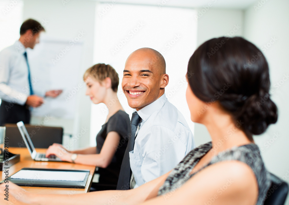 Businessman smiling in meeting Businessman smiling in meeting