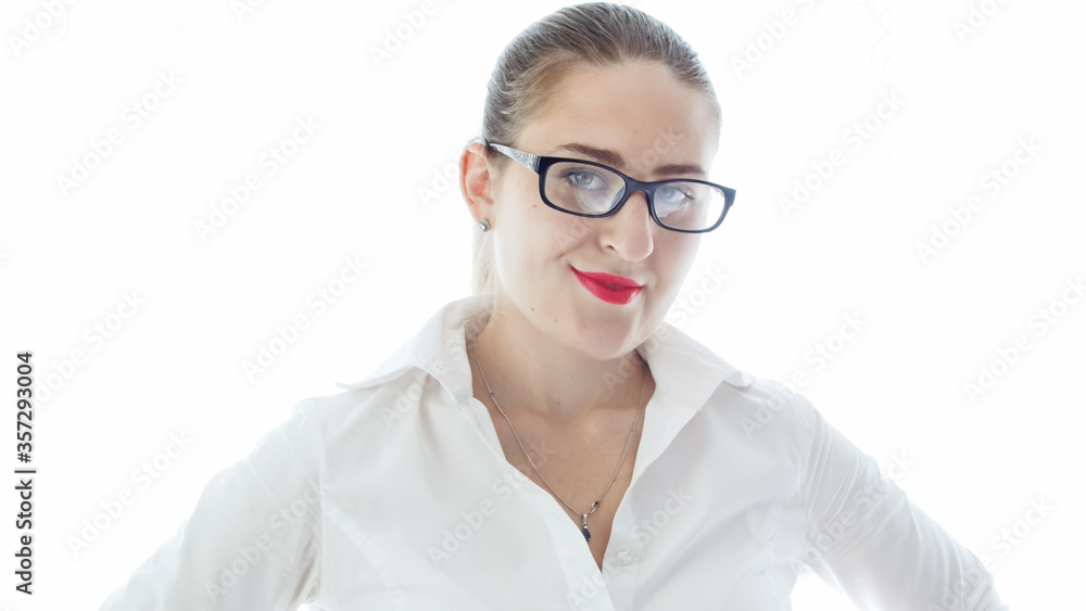 Sexy businesswoman or teacher in eyeglsses looking in camera