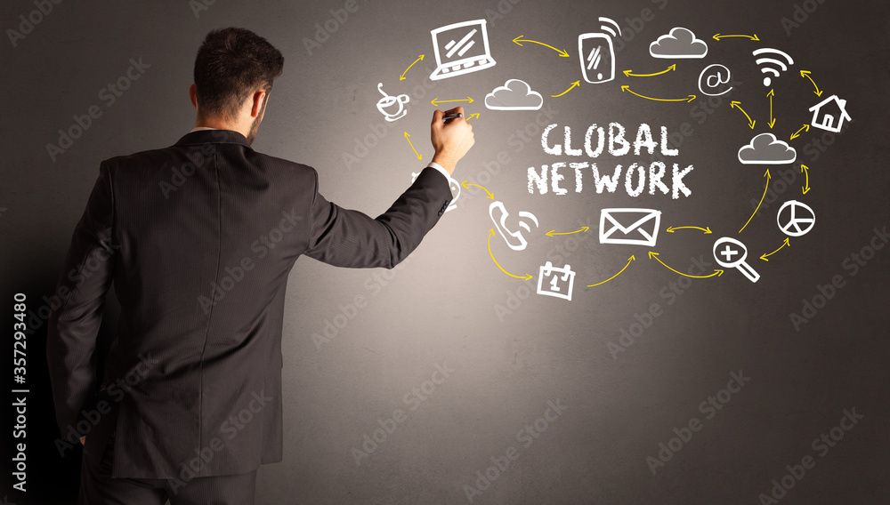 businessman drawing social media icons with GLOBAL NETWORK inscription, new media concept businessman drawing social media icons with GLOBAL NETWORK inscription, new media concept
