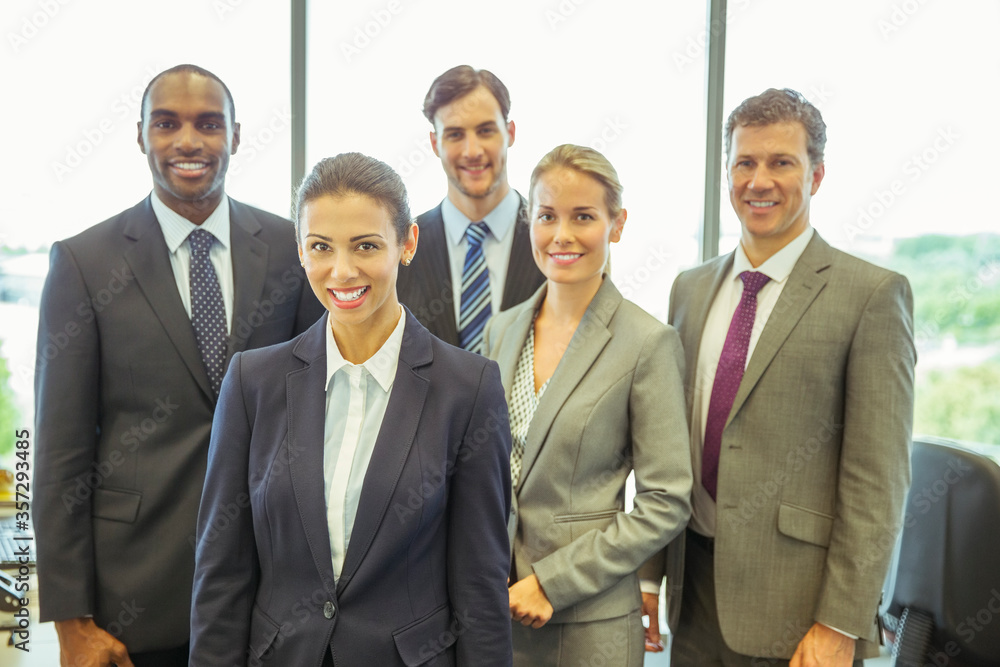 Business people smiling in office Business people smiling in office