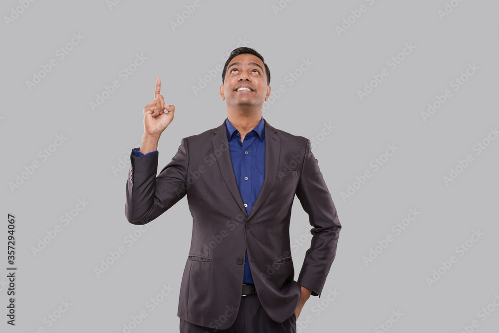 Businessman Poiting Up Isolated. Indian Man Standing Watching Up Businessman Poiting Up Isolated. Indian Man Standing Watching Up