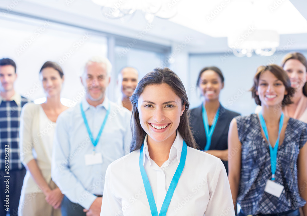 Business people smiling in office Business people smiling in office