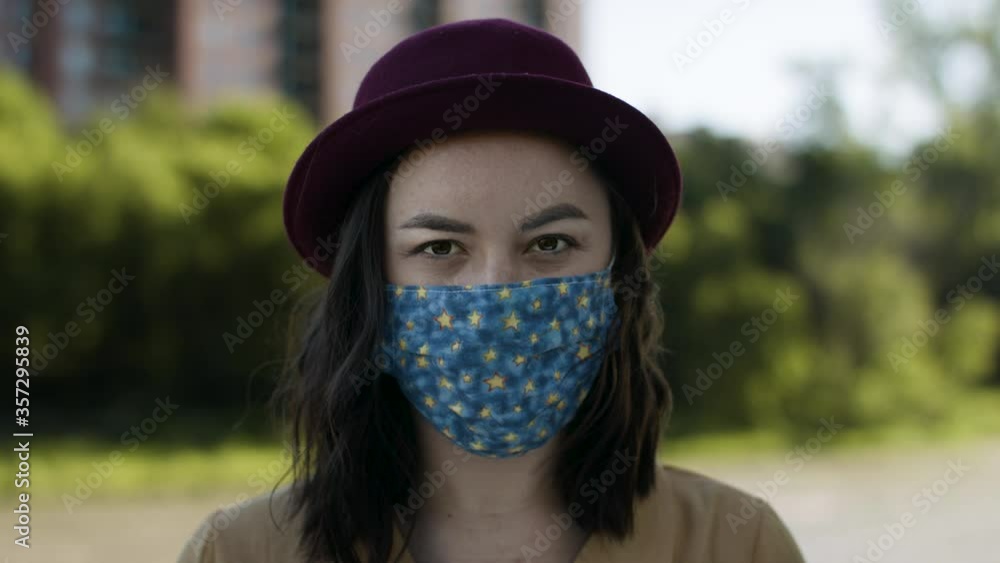 Portrait of a young modern woman wearing a stylish face mask. Medical mask protection for the pandemic virus. Shot in 4k. Portrait of a young modern woman wearing a stylish face mask. Medical mask protection for the pandemic virus. Shot in 4k.