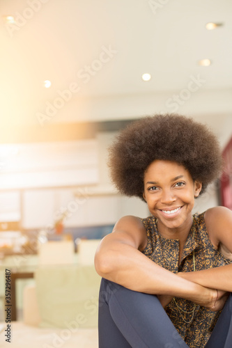 Smiling woman sitting in living room