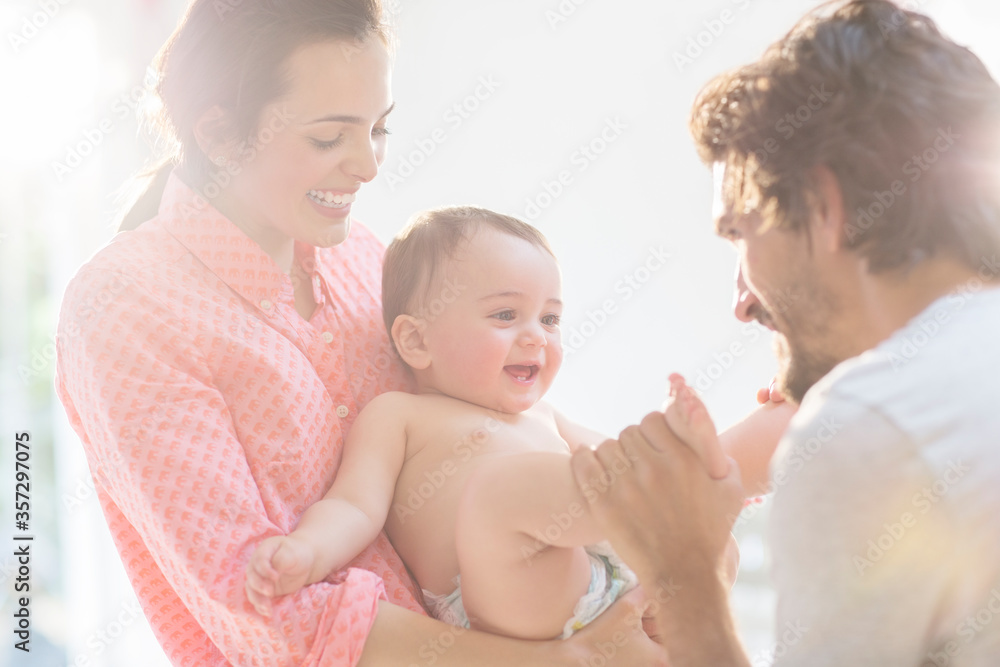 Parents playing with baby boy
