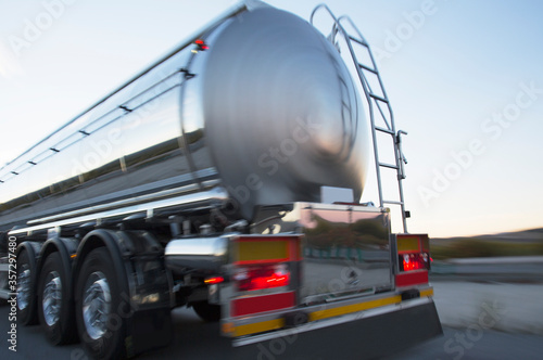 Stainless steel milk tanker on the road photo