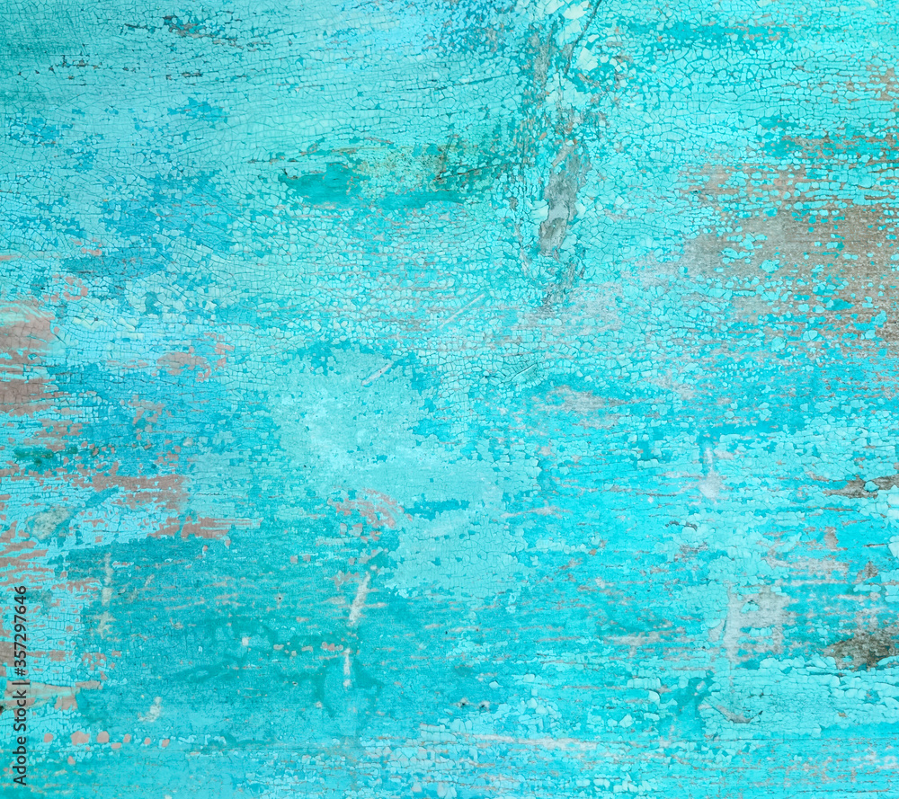 Old teal crackled painted wood surface. Vintage wooden wall or floor with cracked paint.