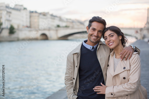 Photography Couple walking along Seine River, Paris, France