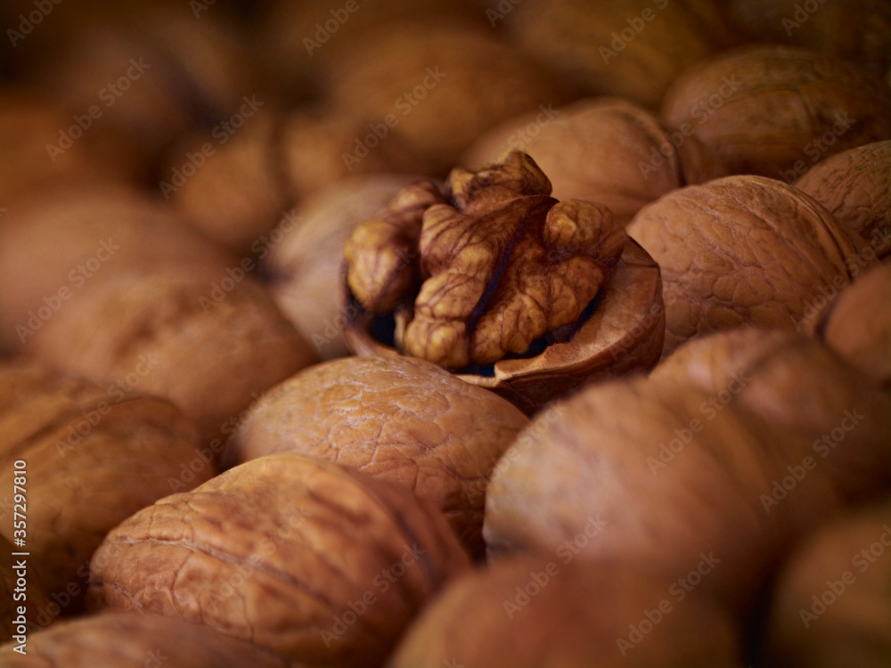 Extreme close up of walnuts shelled and in shell Extreme close up of walnuts shelled and in shell