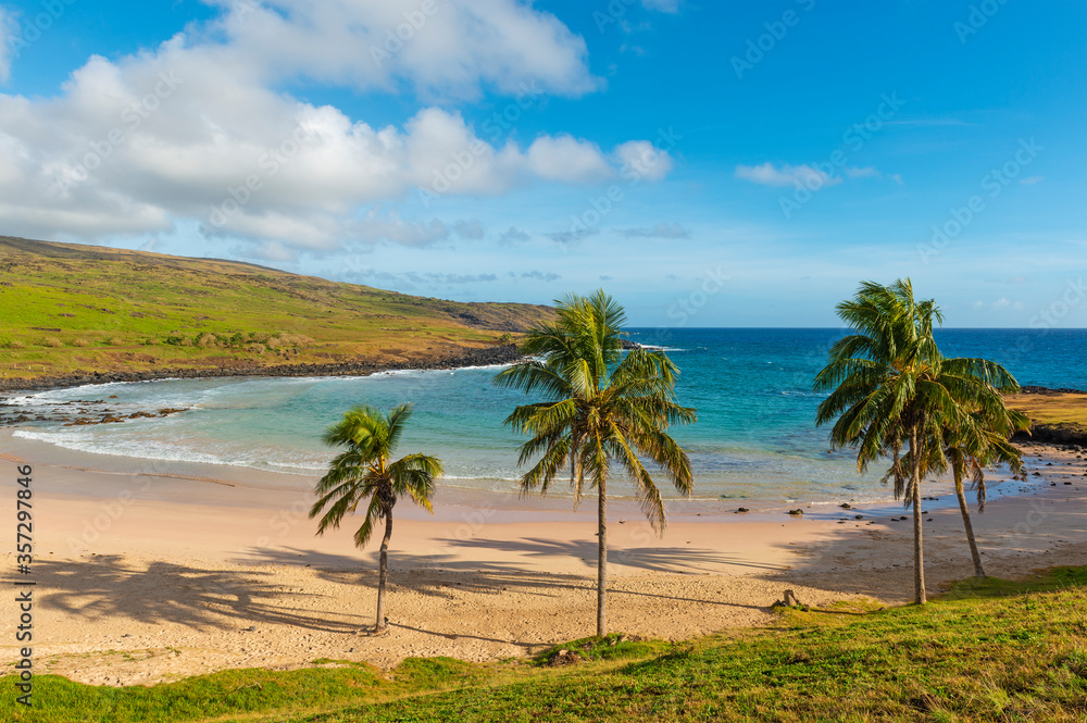 Anakena beach with its palm trees, turquoise colored water sand beach on Easter Island (Rapa Nui), Pacific Ocean, Chile. 