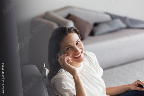 Portrait of confident woman talking on cell phone