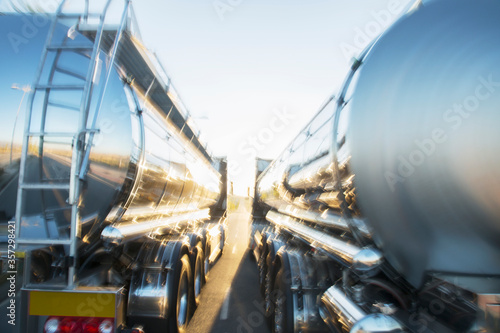 Stainless steel milk tankers side by side