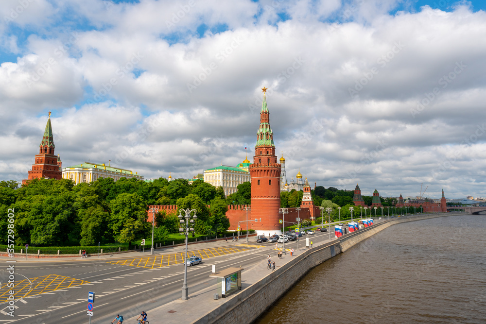 View to the Moscow Kremlin next to the river at cloudy day, summer time shot. Historical heritage of Russia.  