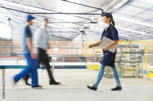 Workers walking in food processing plant
