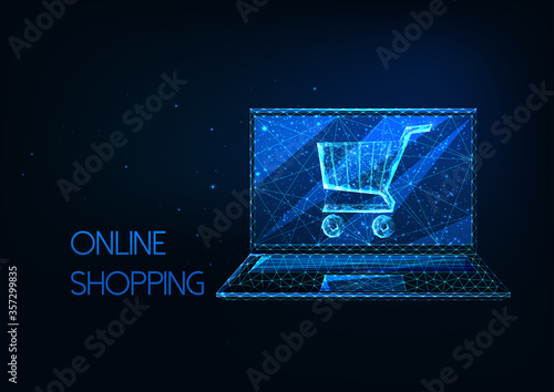 Futuristic online shopping concept with glowing low polygonal laptop and shopping cart i