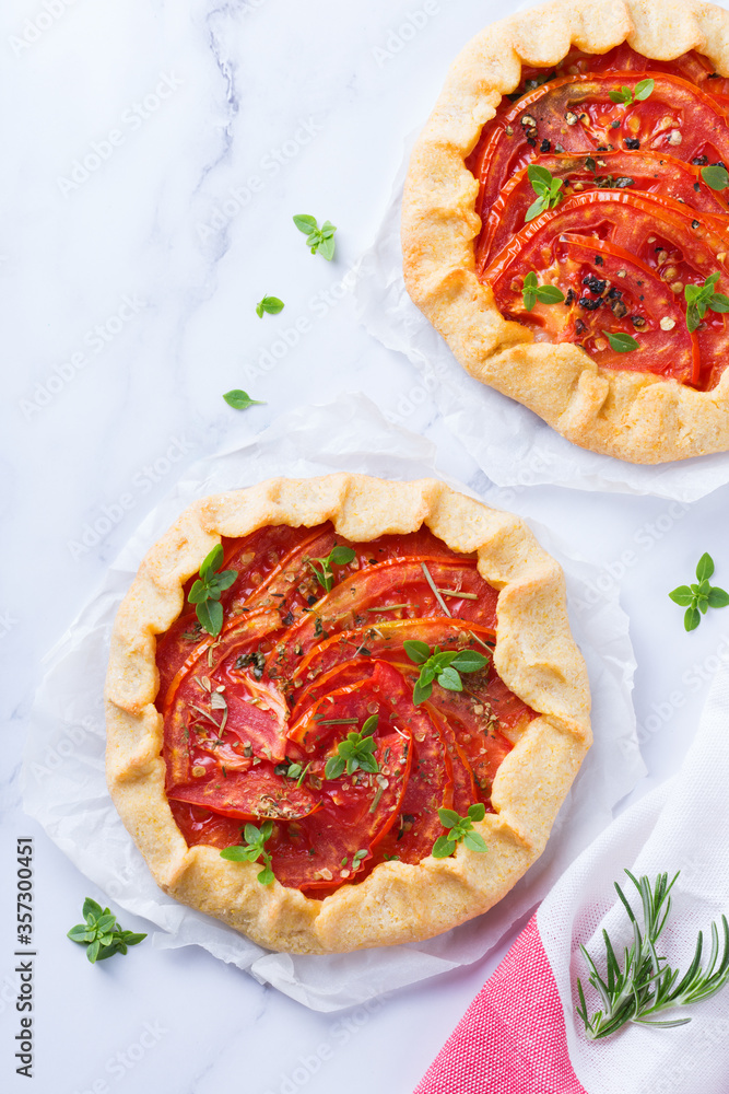 Homemade seasonal savoury summer tomato galette, tart, pie Homemade seasonal savoury summer tomato galette, tart, pie