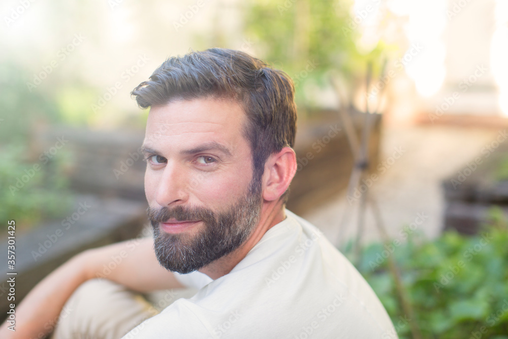Close up of man smiling in backyard Close up of man smiling in backyard