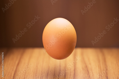 Close up of egg hovering over counter 