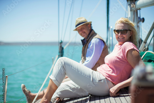 Couple relaxing on deck of sailboat © Paul Bradbury/KOTO