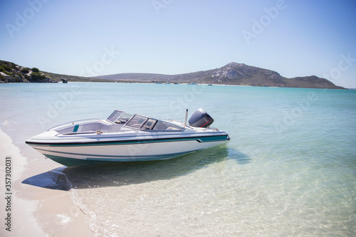 Speedboat beached on shore 