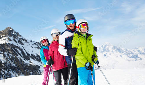 Family skiing on mountain top