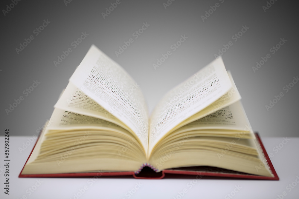 Close up of open book on counter Close up of open book on counter