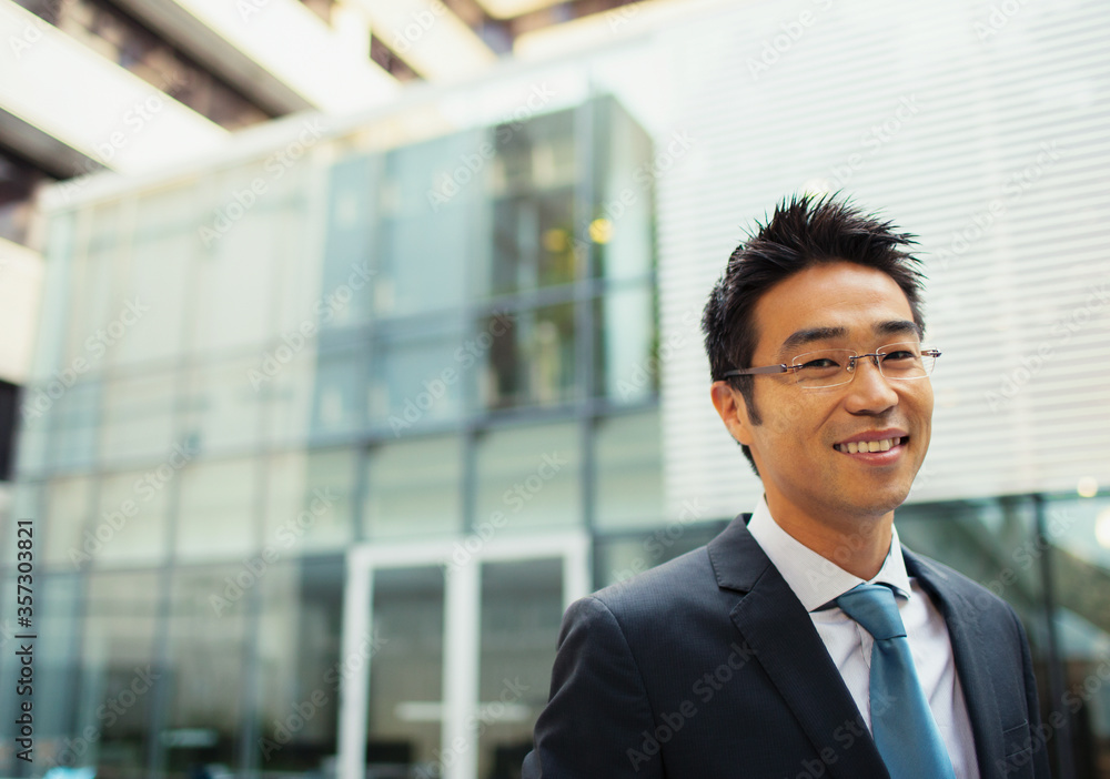 Businessman outside of office building Businessman outside of office building