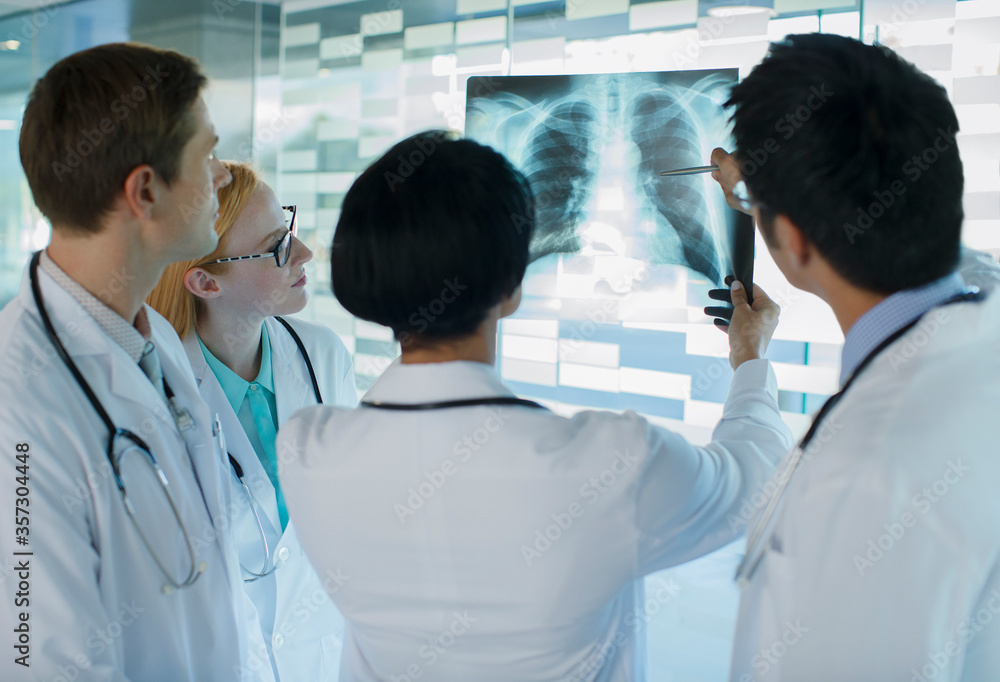 Doctors looking at patient's x-ray Doctors looking at patient's x-ray
