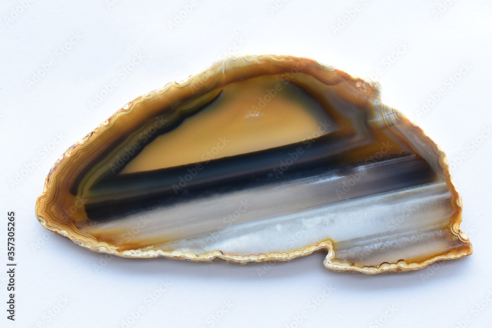Yellow-black striped agate on an isolated background Yellow-black striped agate on an isolated background