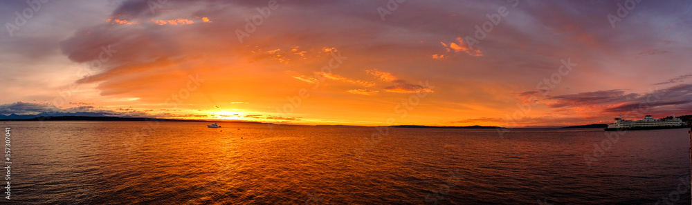 The golden rays of sunset over the ocean water The golden rays of sunset over the ocean water