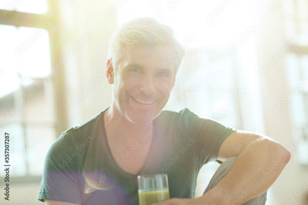 Older man drinking glass of juice Older man drinking glass of juice