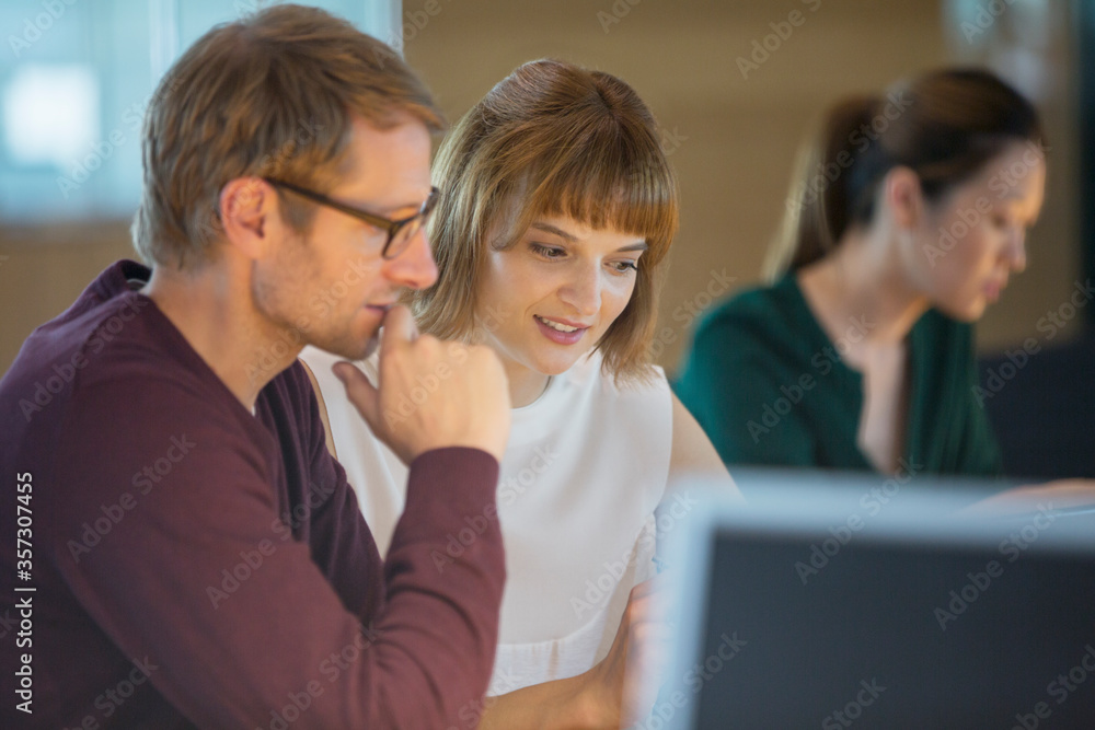 Business people working late in office Business people working late in office