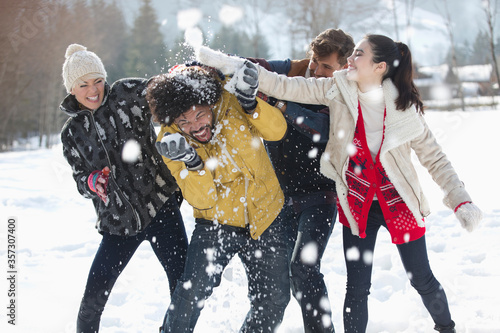 Friends enjoying snowball fight