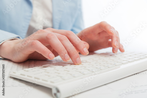 Business woman using computer keyboard