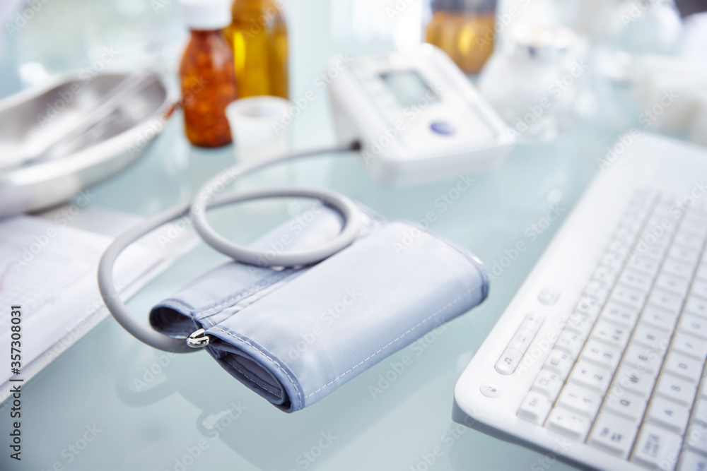 Desk with pressure gauge, keyboard and flasks with pills Desk with pressure gauge, keyboard and flasks with pills