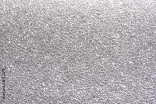 White plastic package background texture close up. Top view.