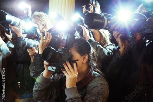 Paparazzi photographers photographing event photo