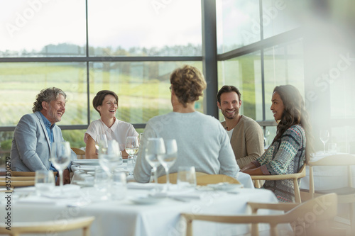 Friends at winery dining room table