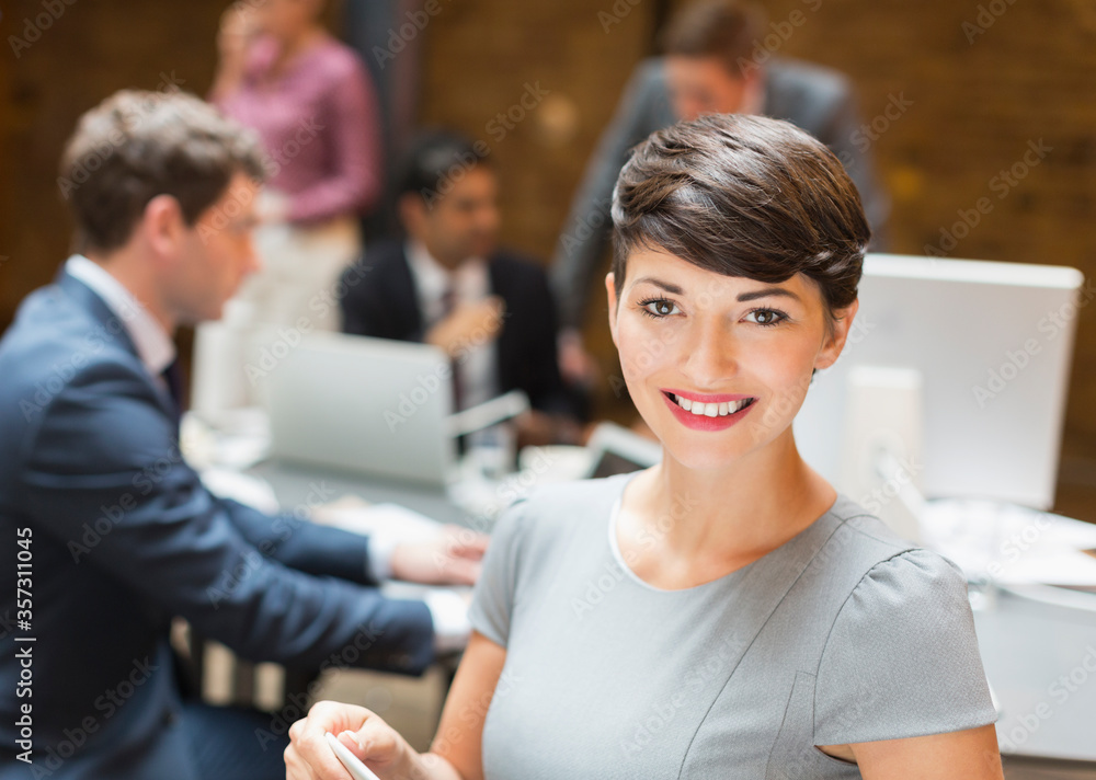 Portrait confident businesswoman in office Portrait confident businesswoman in office