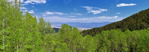 Rocky Mountain Wasatch Front peaks, panorama landscape view from Butterfield Canyon Oquirrh range toward Provo, Tooele Utah Lake by Rio Tinto Bingham Copper Mine, Great Salt Lake Valley in spring. Uta photo