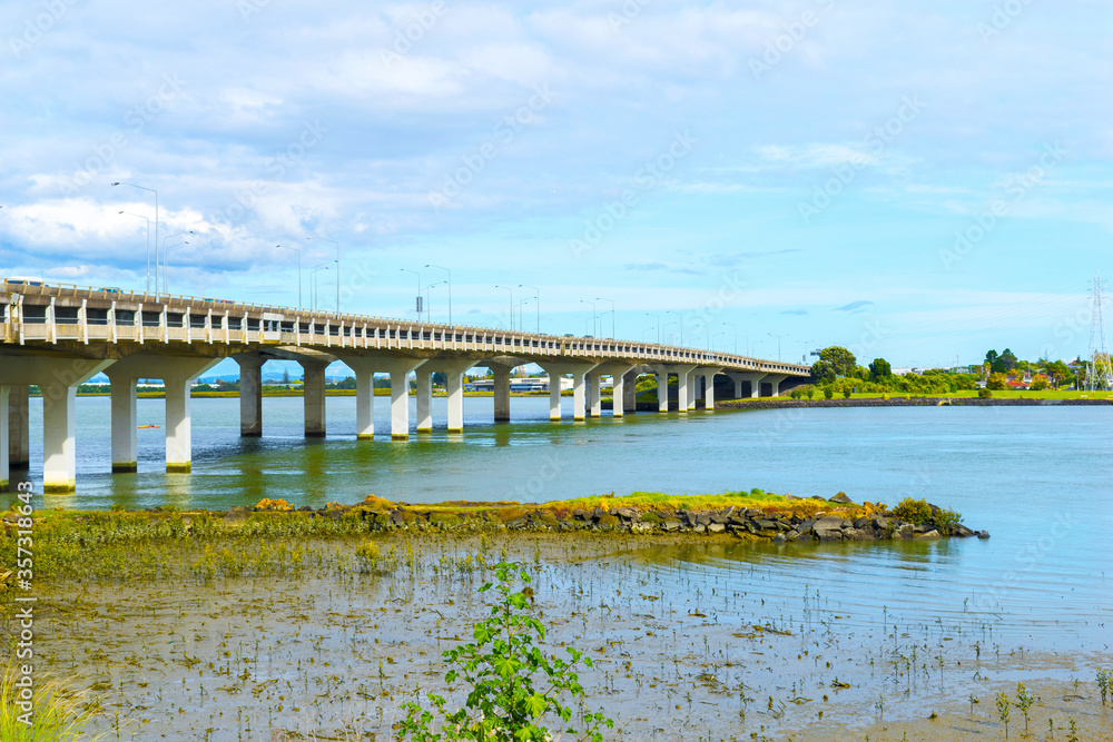 Landscape View to Mangere bridge over the Manukau Harbour, Motorway Bridge in South-Western Auckland New Zealand