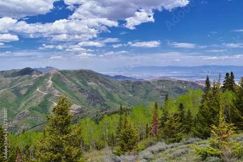 Rocky Mountain Wasatch Front peaks, panorama landscape view from Butterfield Canyon Oquirrh range toward Provo, Tooele Utah Lake by Rio Tinto Bingham Copper Mine, Great Salt Lake Valley in spring. Uta