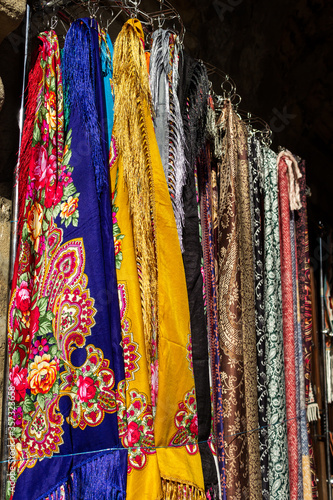 Scarves of different nations and nationalities of all time are for sale in the old city © Gozalov