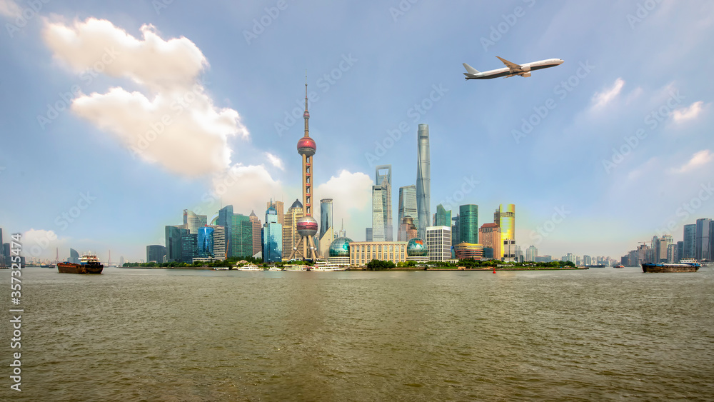 Shanghai skyline in Lujiazui Pudong business center district with airplane at Shanghai, China.