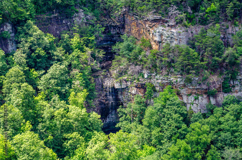 mountain landscape with trees and waterfall