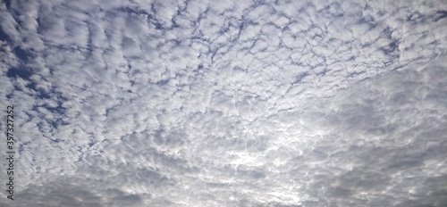 The morning sky, white clouds alternating with natural waves, obscures the blue background from Thailand.