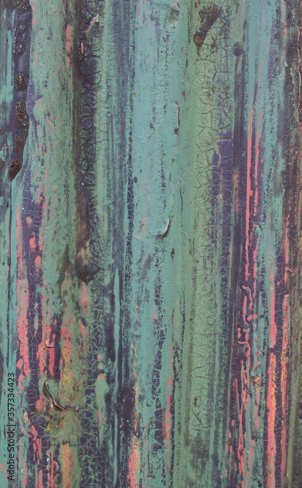 Old weathered corrugated sheet /panel with peeled paint. Background texture of rusty painted corrugated iron cladding Old weathered corrugated sheet /panel with peeled paint. Background texture of rusty painted corrugated iron cladding
